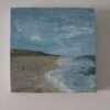 Schilderij - Minimalistisch strand met een detail
